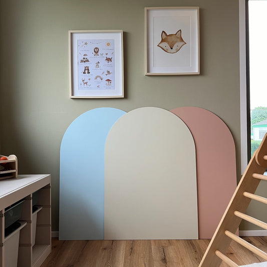 Minimalistic arched playboards in pastel colors, enhancing a cozy children's room aesthetic.